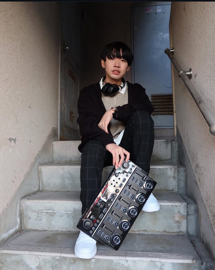 Tako poses on a staircase with an RC-505 loopstation